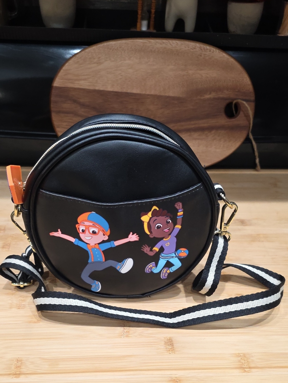 Kids Black Round Crossbody Bag with Playful Cartoon Skaters